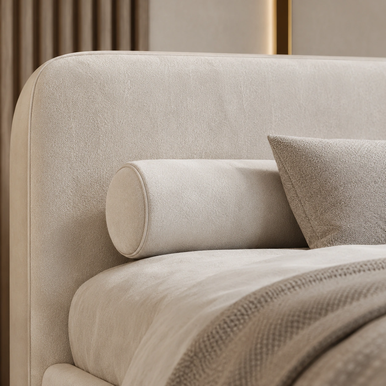 Close detail of ivory upholstery and a cylindrical bolster