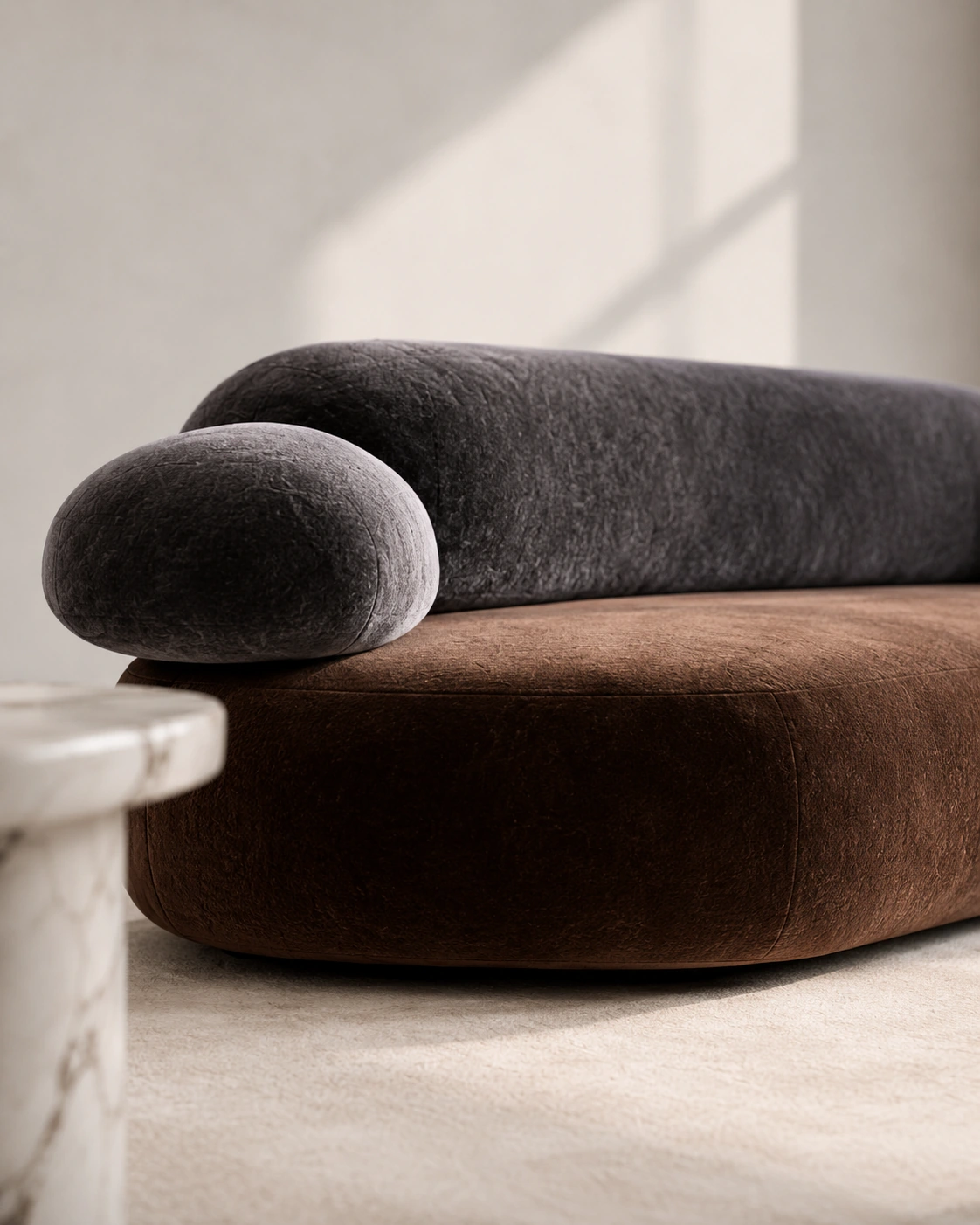 Low-angle view of a chocolate and charcoal modular sofa