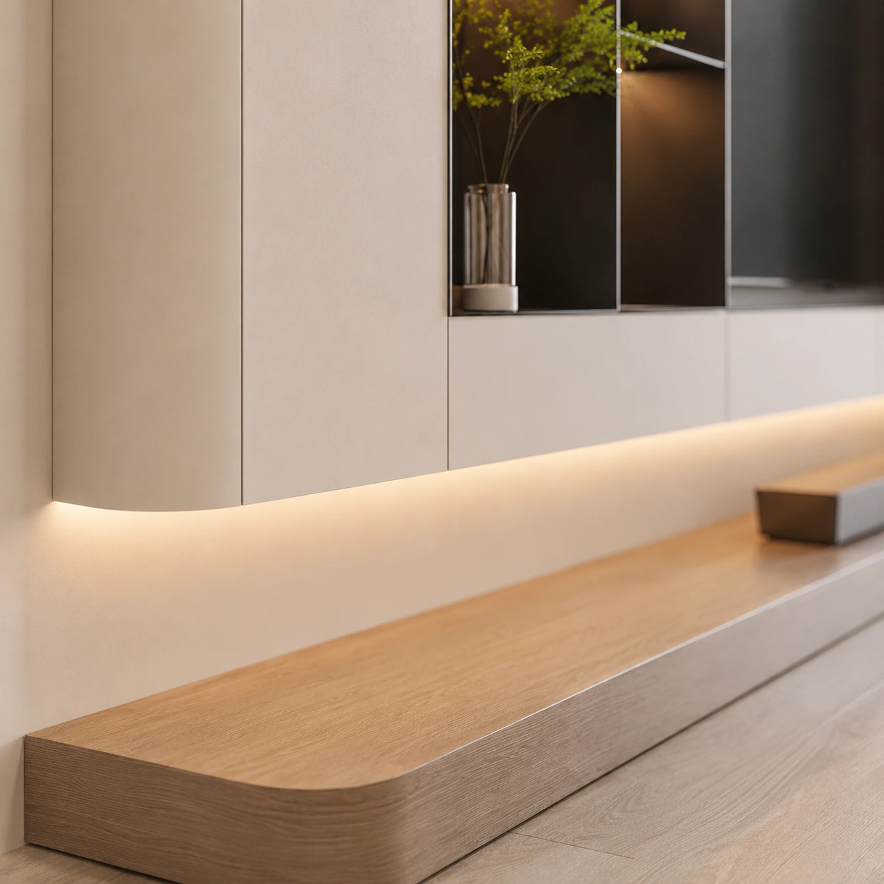 Close detail of the illuminated display niche and rounded oak joinery